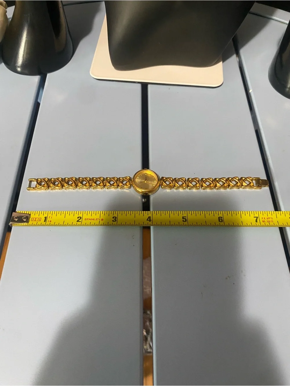 Decan De La Renta gold tone designer watch